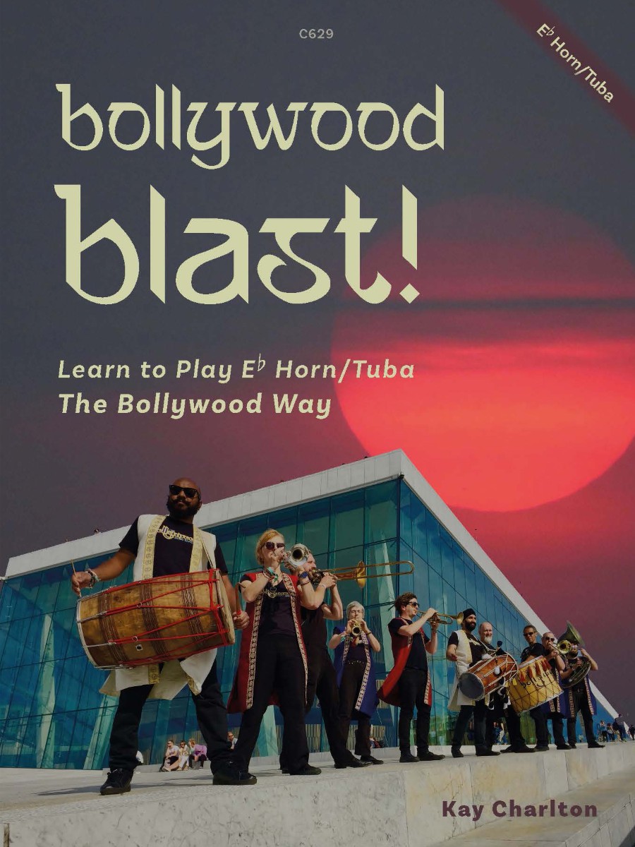 A book cover titled "bollywood blast!" with "Learn to Play Eb Horn/Tuba The Bollywood Way" and "Kay Charlton" at the bottom. The image features a group of musicians playing instruments, including a dhol drum and brass instruments, in front of a modern building with a red sky in the background. "C629" is in the top center, and "Eb Horn/Tuba" is diagonally in the top right corner.